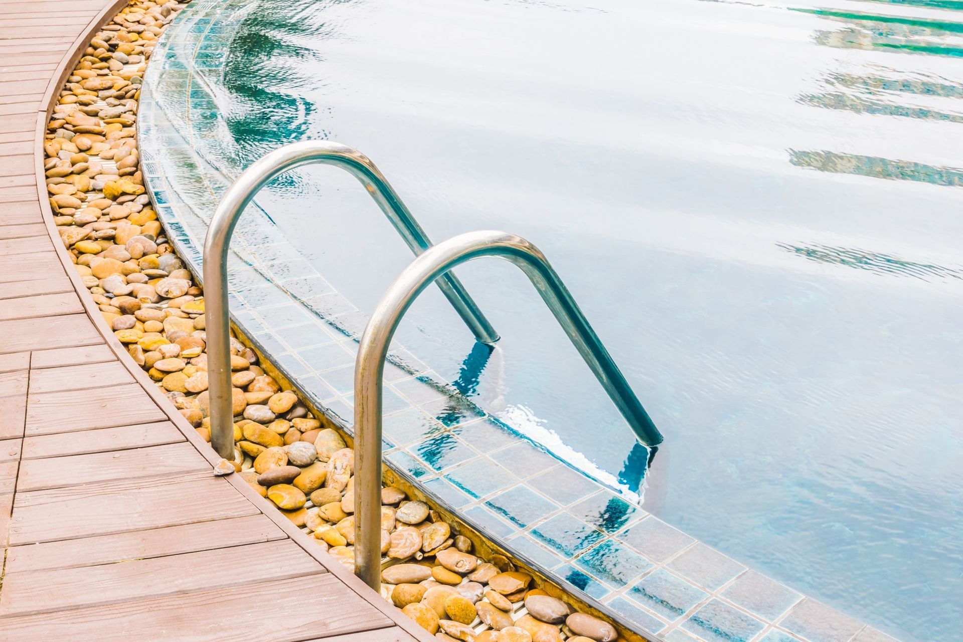 A close up of a swimming pool with stairs leading into it.