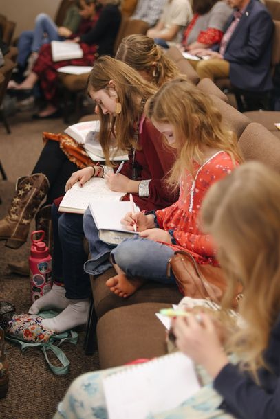 Multi-generational worship service with kids in the service.