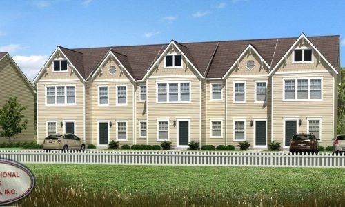 A rendering of a row of houses with a white picket fence