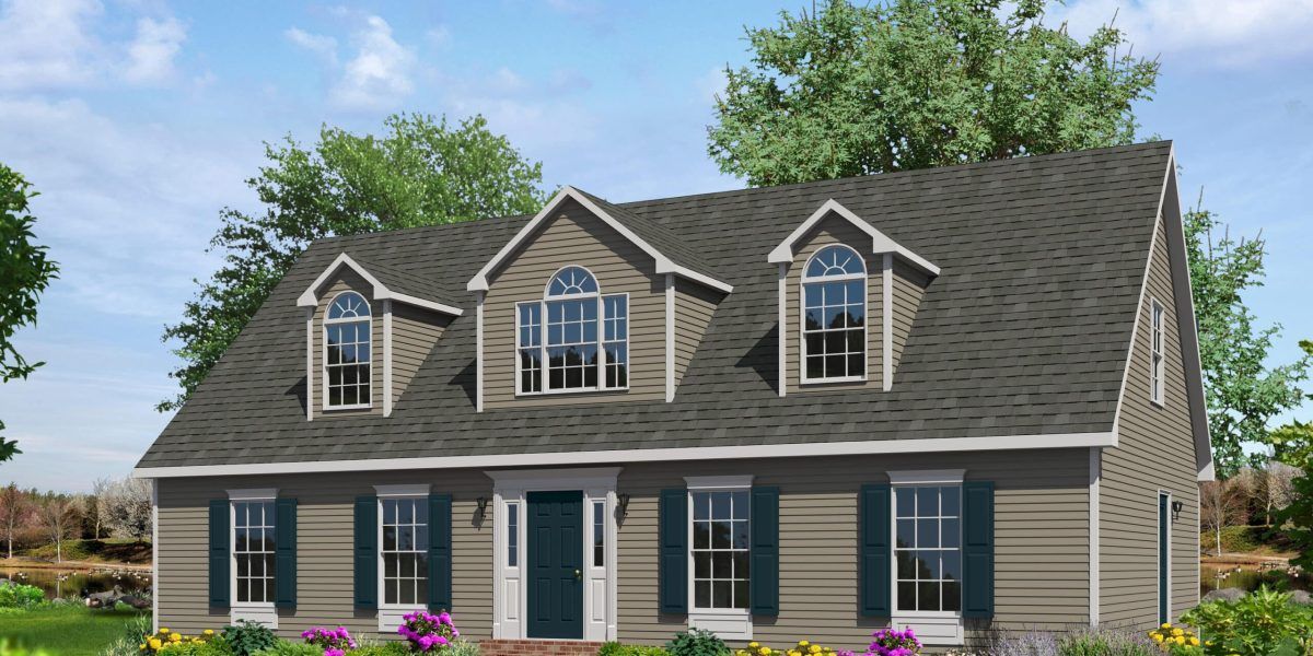 Two-story gray house with dormer windows, dark roof, and blue shutters in a landscaped yard