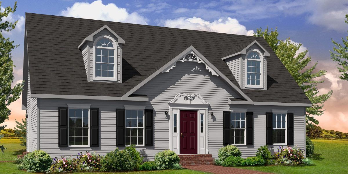 Gray house with black shutters, maroon front door, and dormer windows on a sunny day