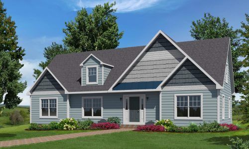 Gray suburban house with white trim, dark roof, front porch, and landscaped lawn under a blue sky