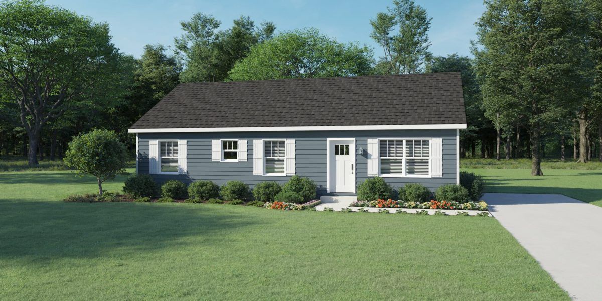 A blue house with white shutters and a black roof is sitting on top of a lush green field.