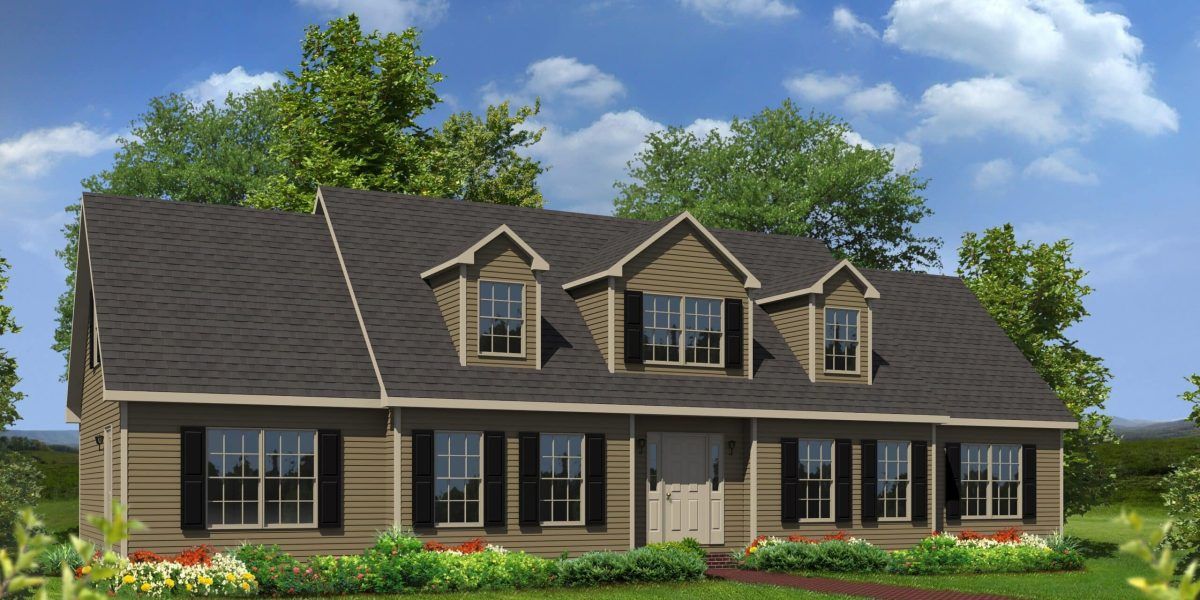 Single-story brick house with dark roof, dormer windows, and a green lawn under a blue sky