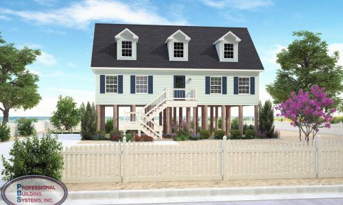 Large white house with blue shutters, dormer windows, porch, and white picket fence by the water