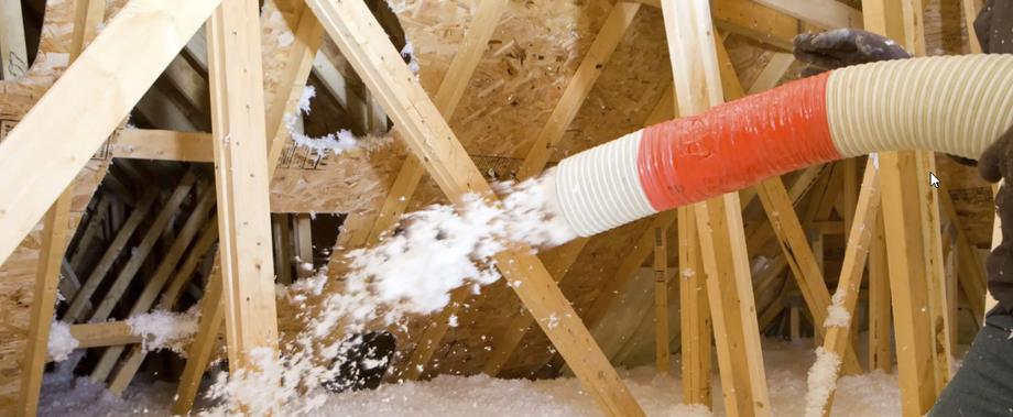 Insulation installation in Michigan home attic