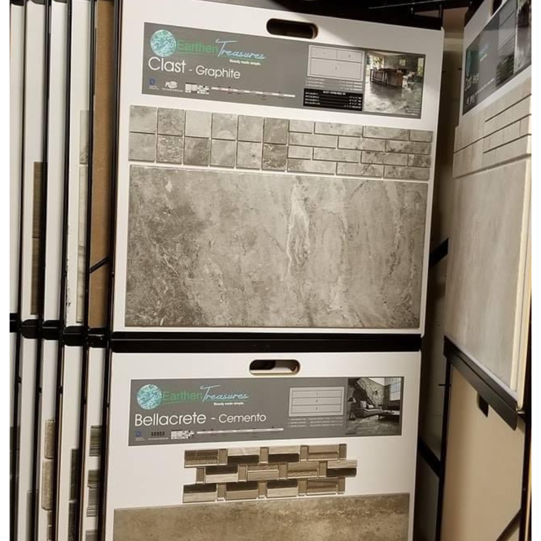 Tile display with samples, including gray and beige variations, in a store setting.