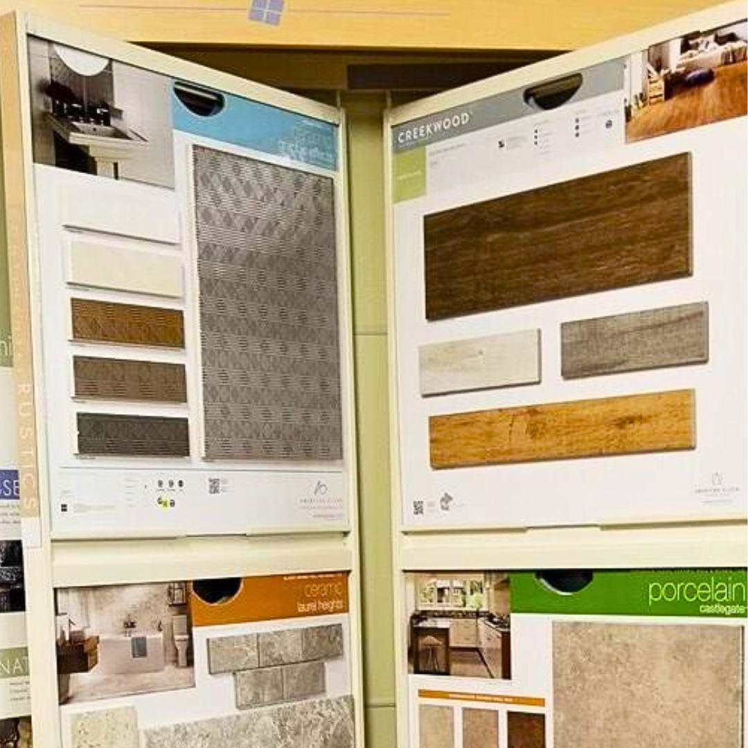 Tile samples displayed on a store rack; various colors and textures.