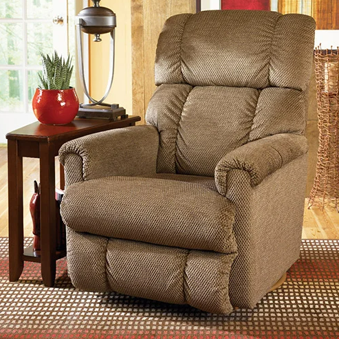 Brown recliner next to a wooden side table with a plant and lamp.
