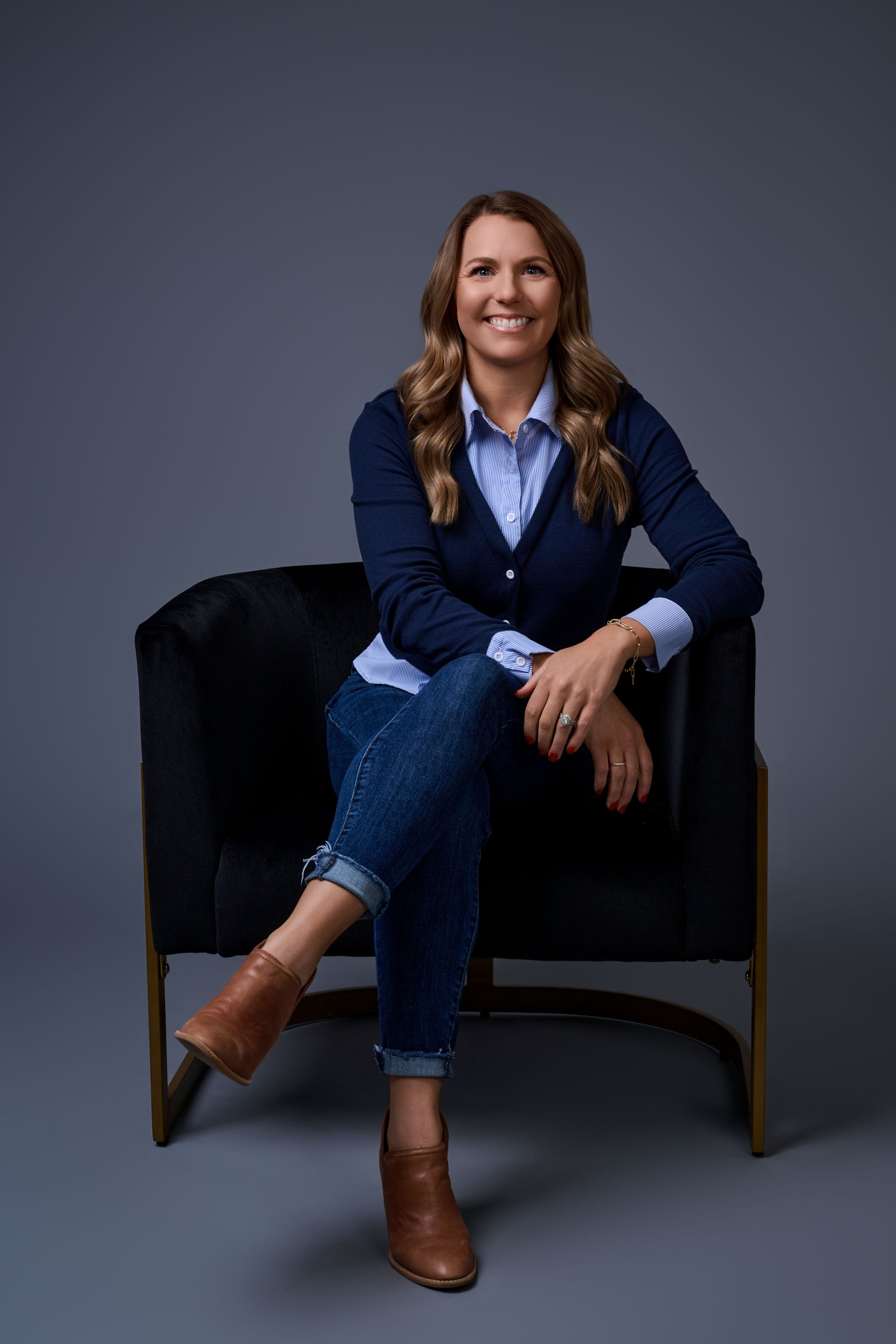 Headshot of Jocelyn Wolff, Executive Office Lead at Wolff Construction, smiling in a blue sweater.