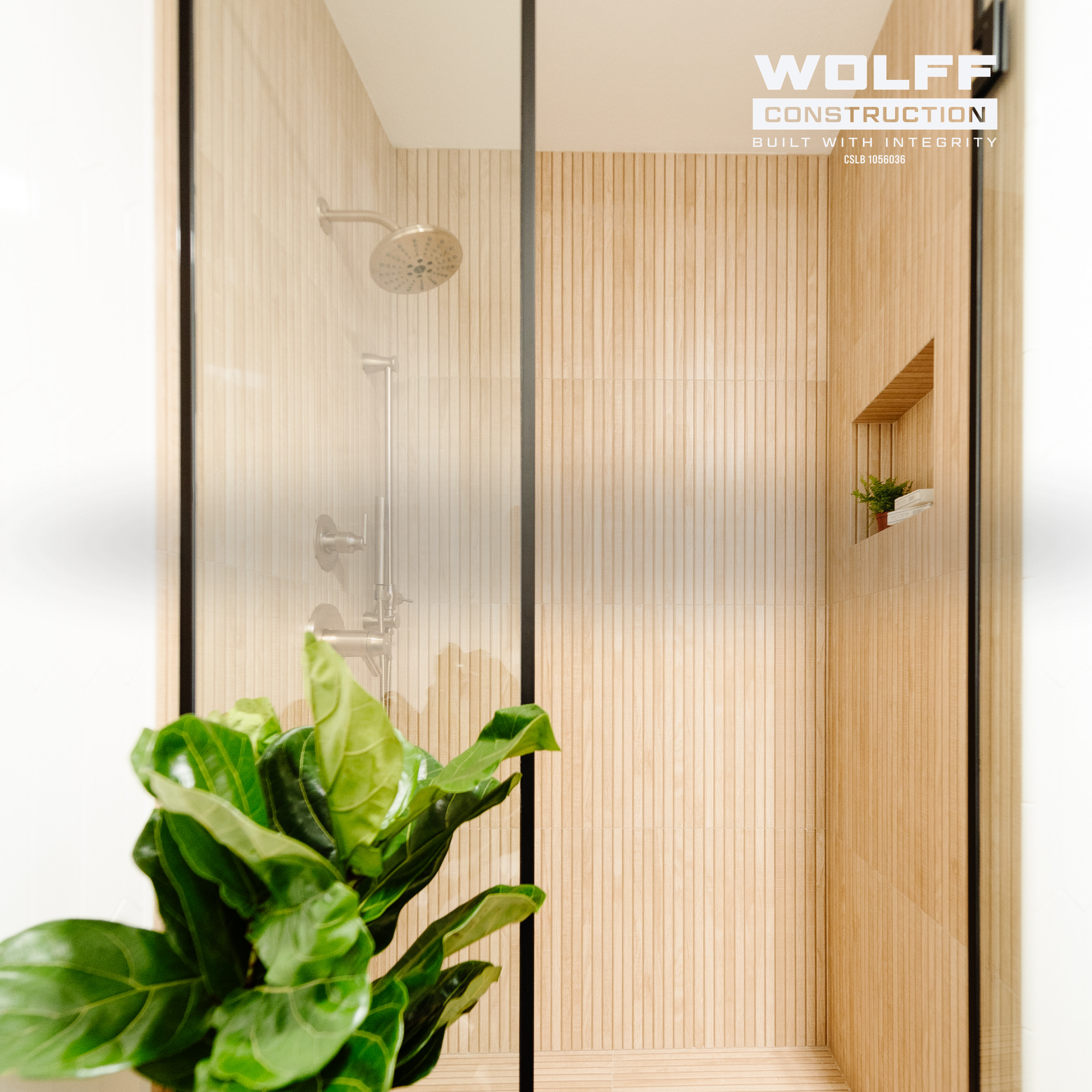 Luxury bathroom remodel in Granite Bay with walk-in shower and wood-look tile by Wolff Construction.