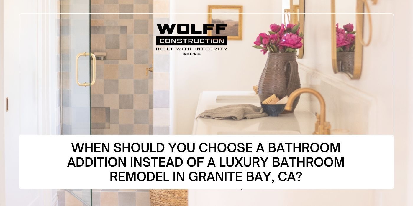 Granite Bay luxury bathroom remodel with checkered tile shower and brass trim by Wolff Construction.