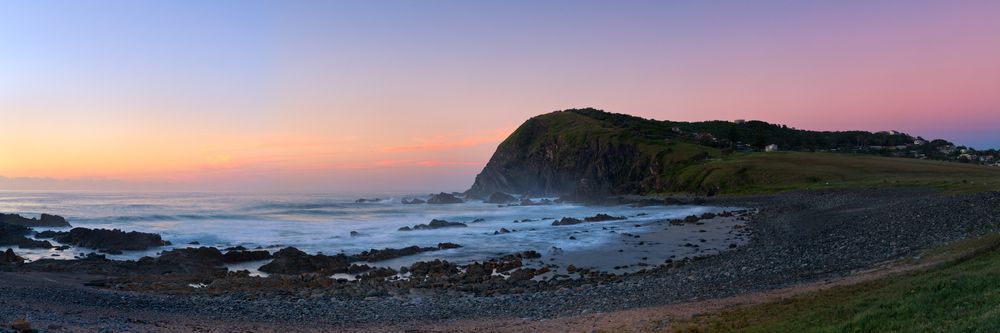 A Panoramic View Of A Cliff Overlooking The Ocean At Sunset — Mid Coast Coatings In Crescent Head, NSW
