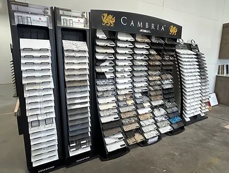 Cambridge sample display with rows of white swatches in black floor stands