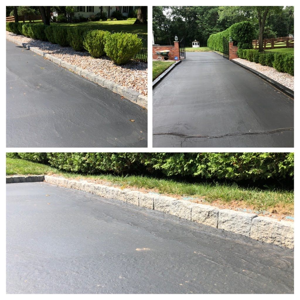 Driveway resurfaced with smooth black asphalt beside white stone edging and green hedges