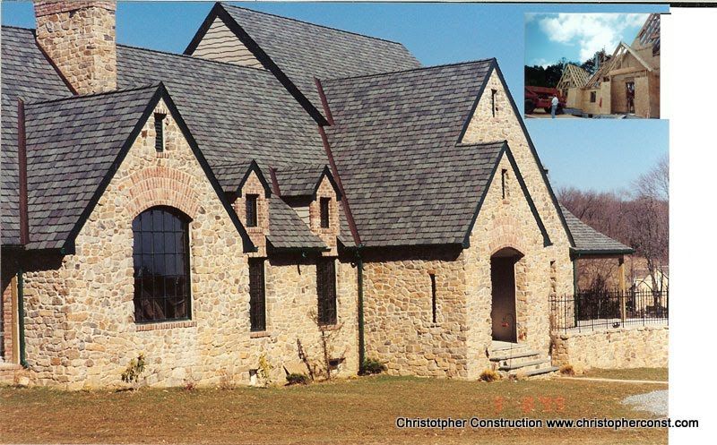 Stone house with steep shingle roof and arched windows, shown with a small inset view of the front entrance