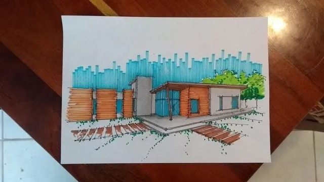 Diseño moderno de una casa dibujado a mano, con un fondo azul de boceto y detalles de madera naranja sobre papel blanco