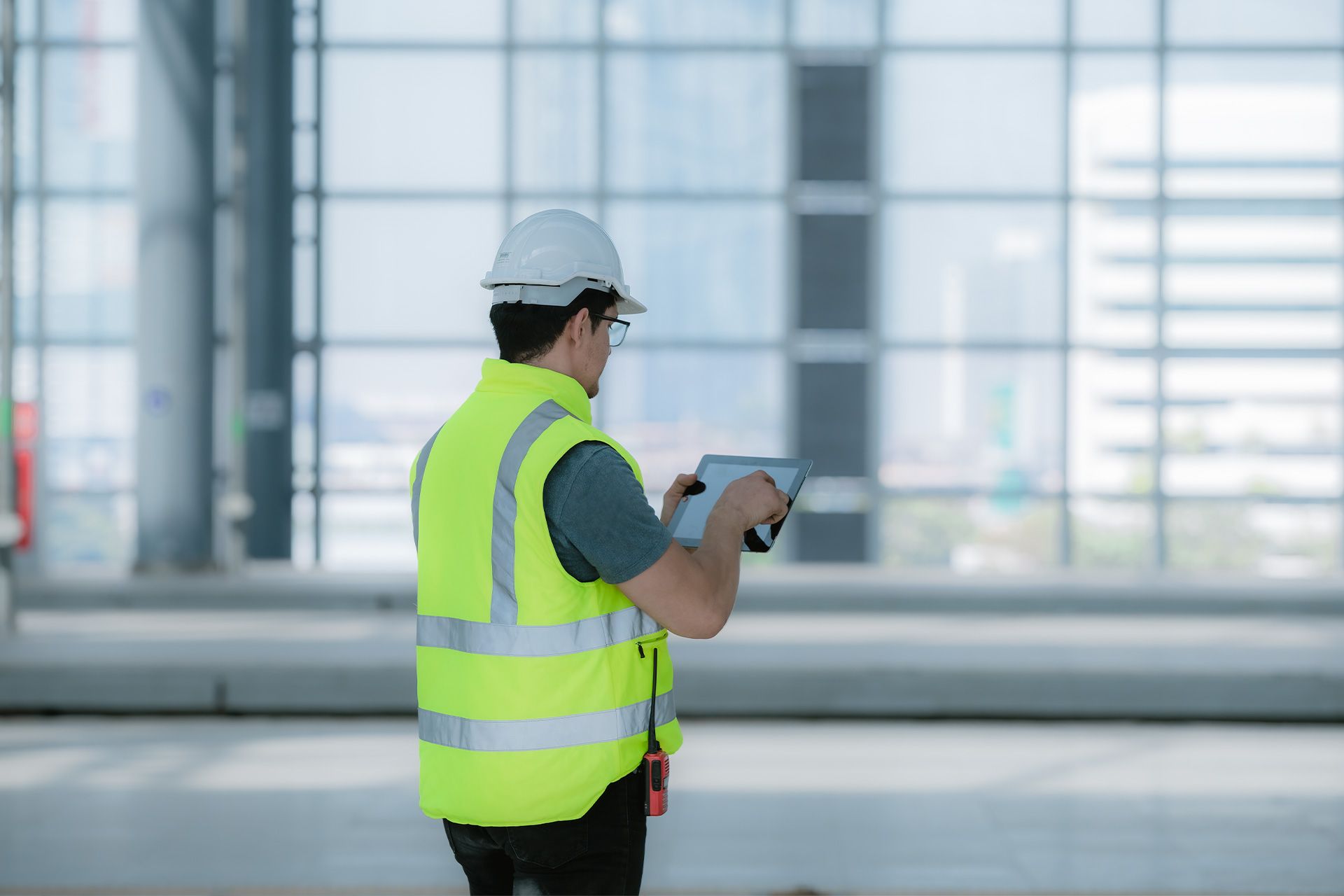 Commercial inspector reviewing building systems