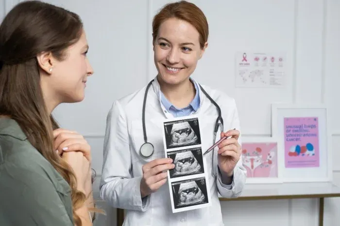 Doctor showing ultrasound images to a patient in a medical office.