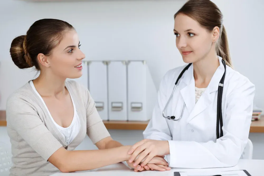 fertility specialist with patient in Aubrey