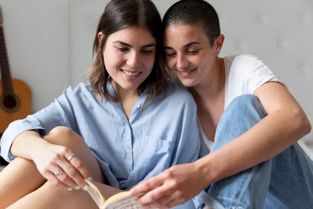 lesbian couple sitting together, researching IVF for lesbian couples in Frisco