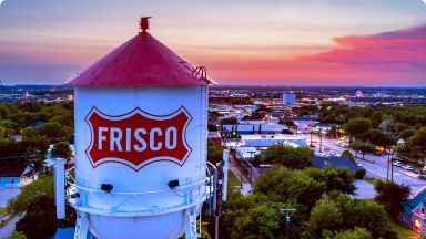 Frisco water tower with red top and