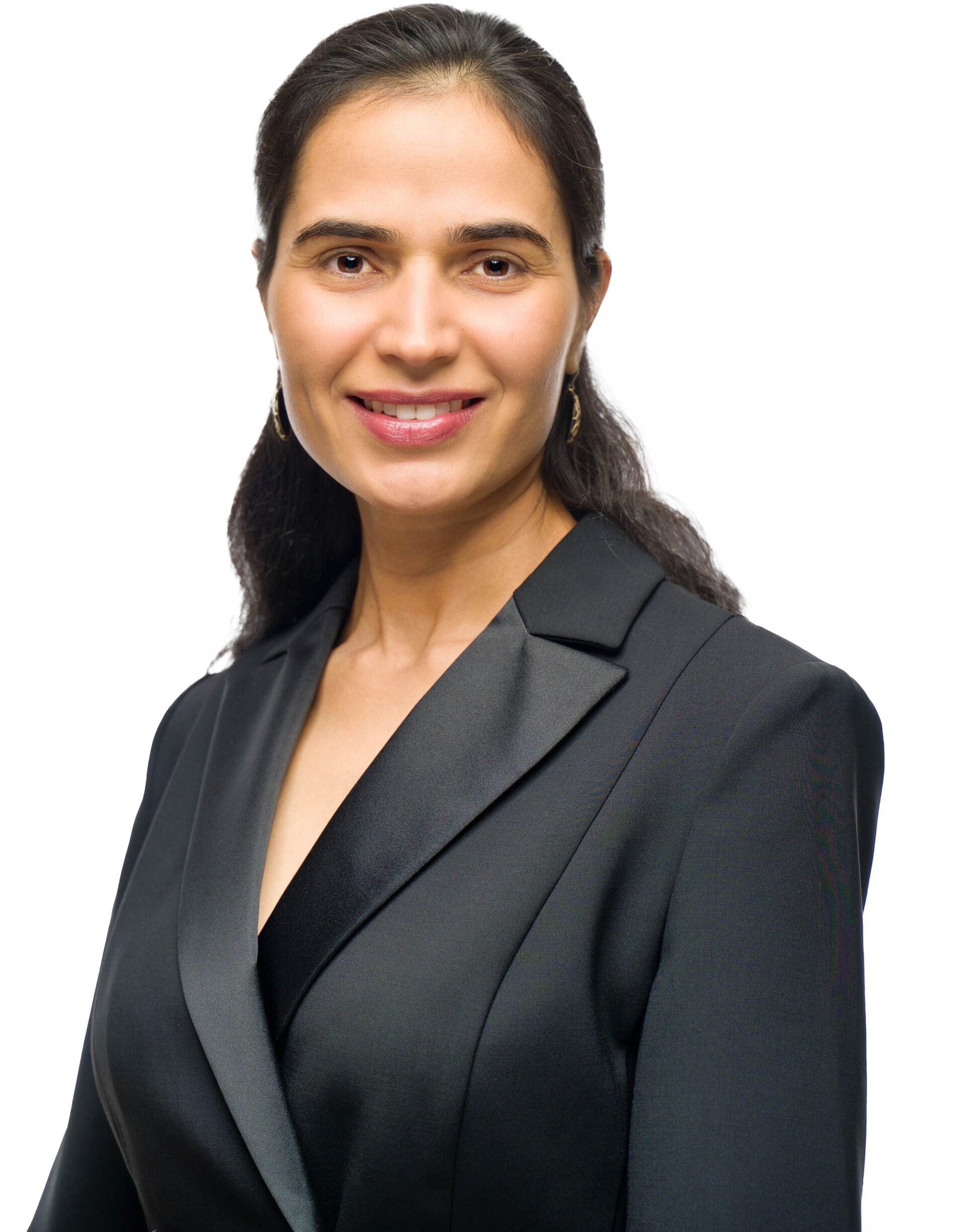 Woman wearing a black blazer smiles, posing for a professional headshot.