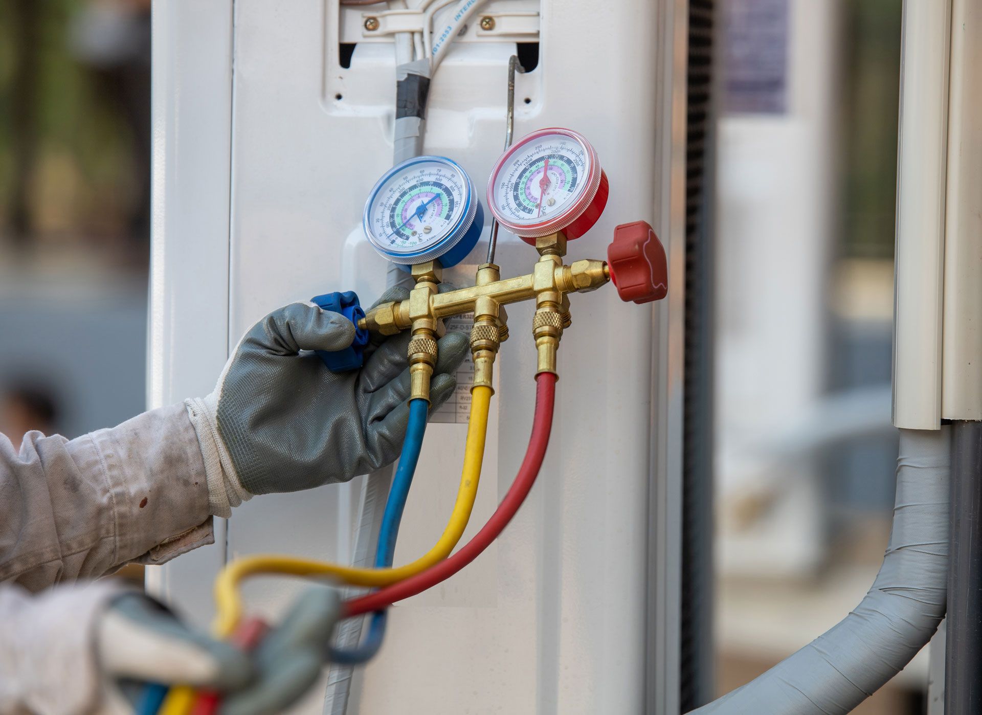 HVAC technician with gauges