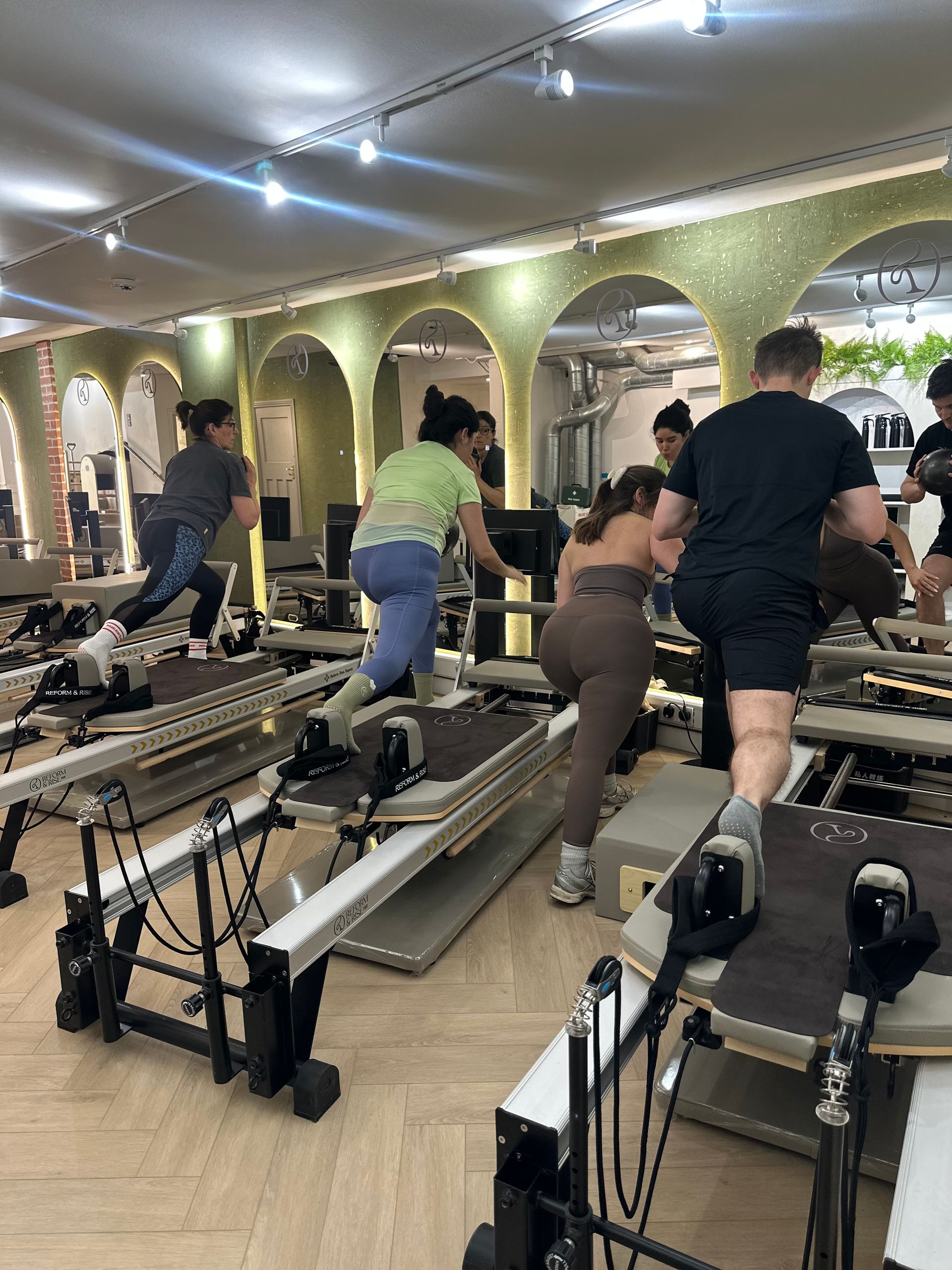 Pilates class in session at Reform & Rise Pilates boutique studio East London