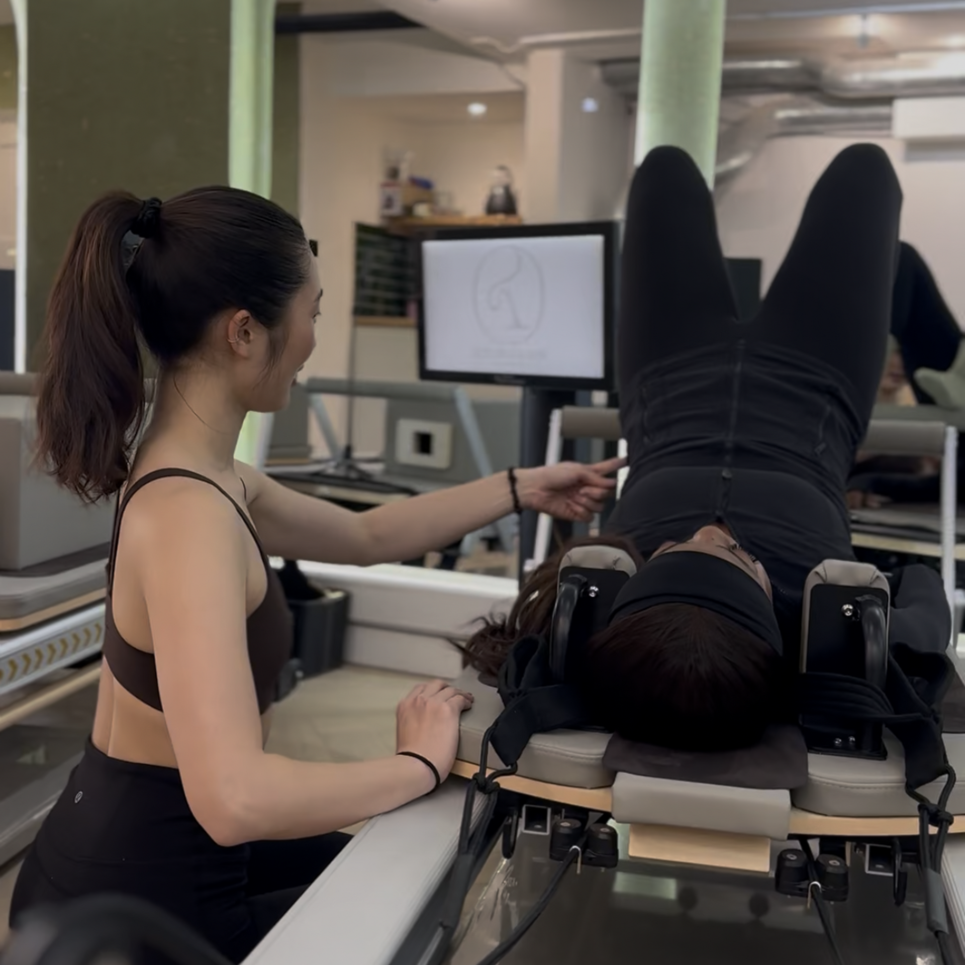 
Client performing Pilates exercise in 121 session  at Reform & Rise Pilates studio Roman Road East London