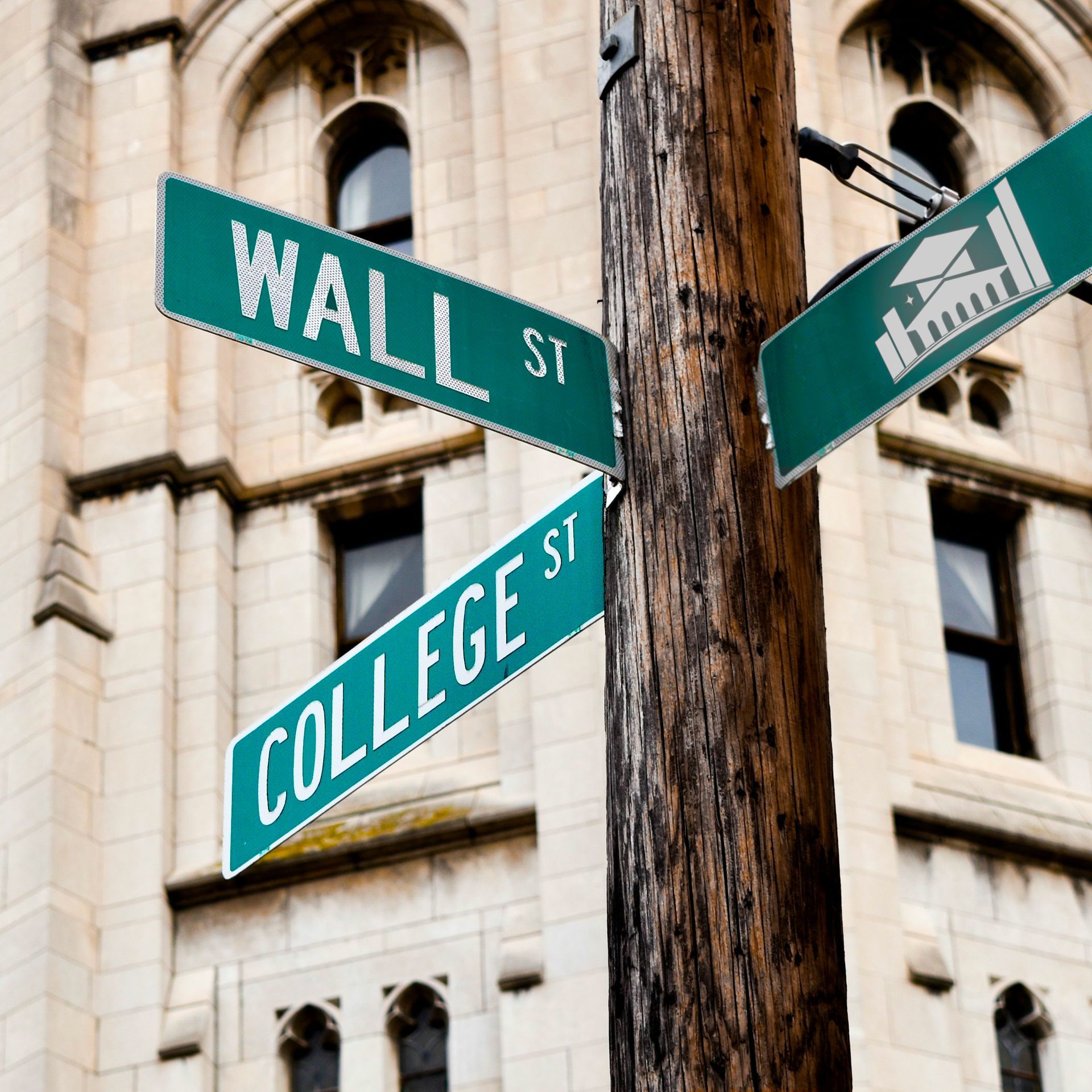 Green Wall St and College St signs on a wooden pole in front of a stone building.