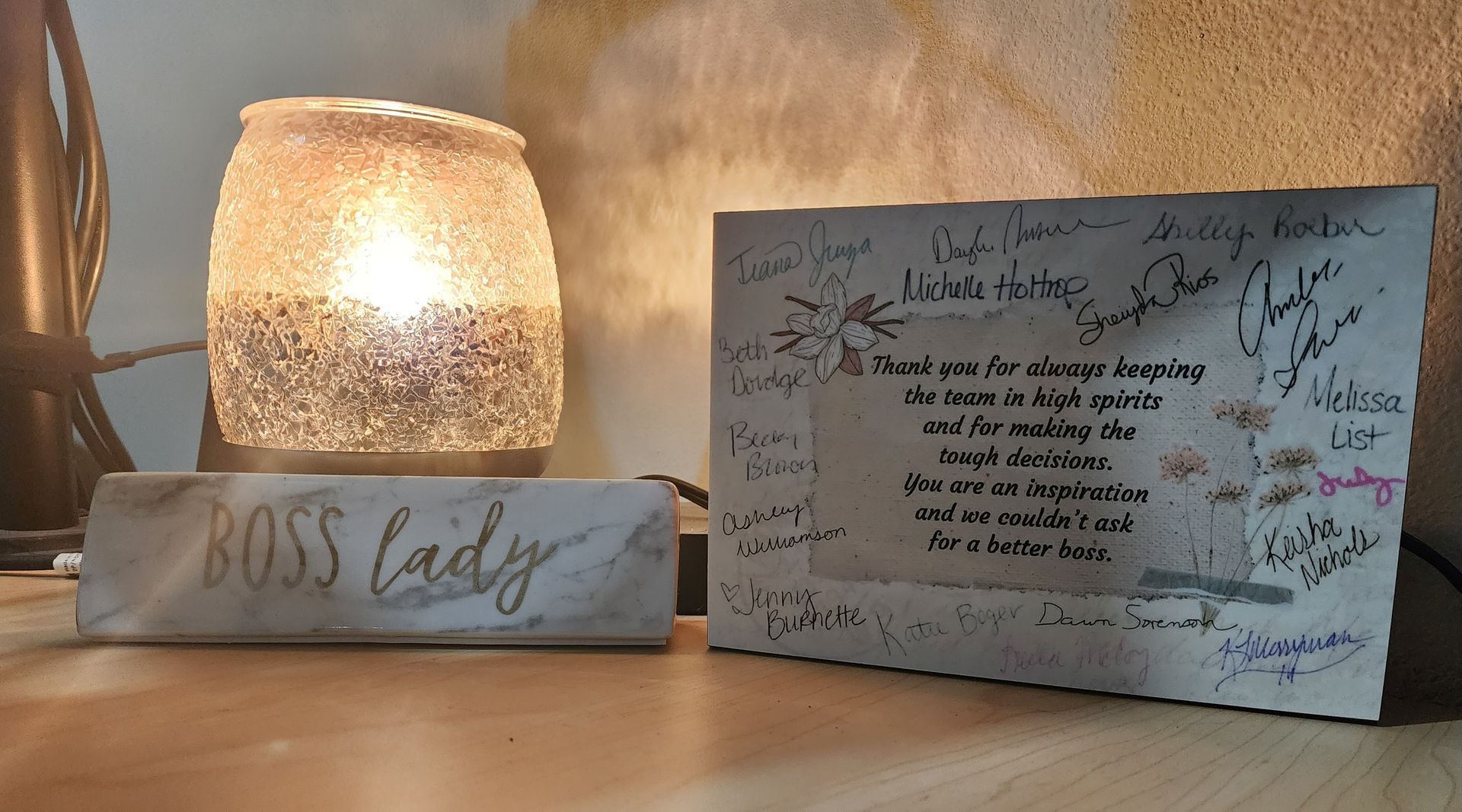 A lit candle sits next to a