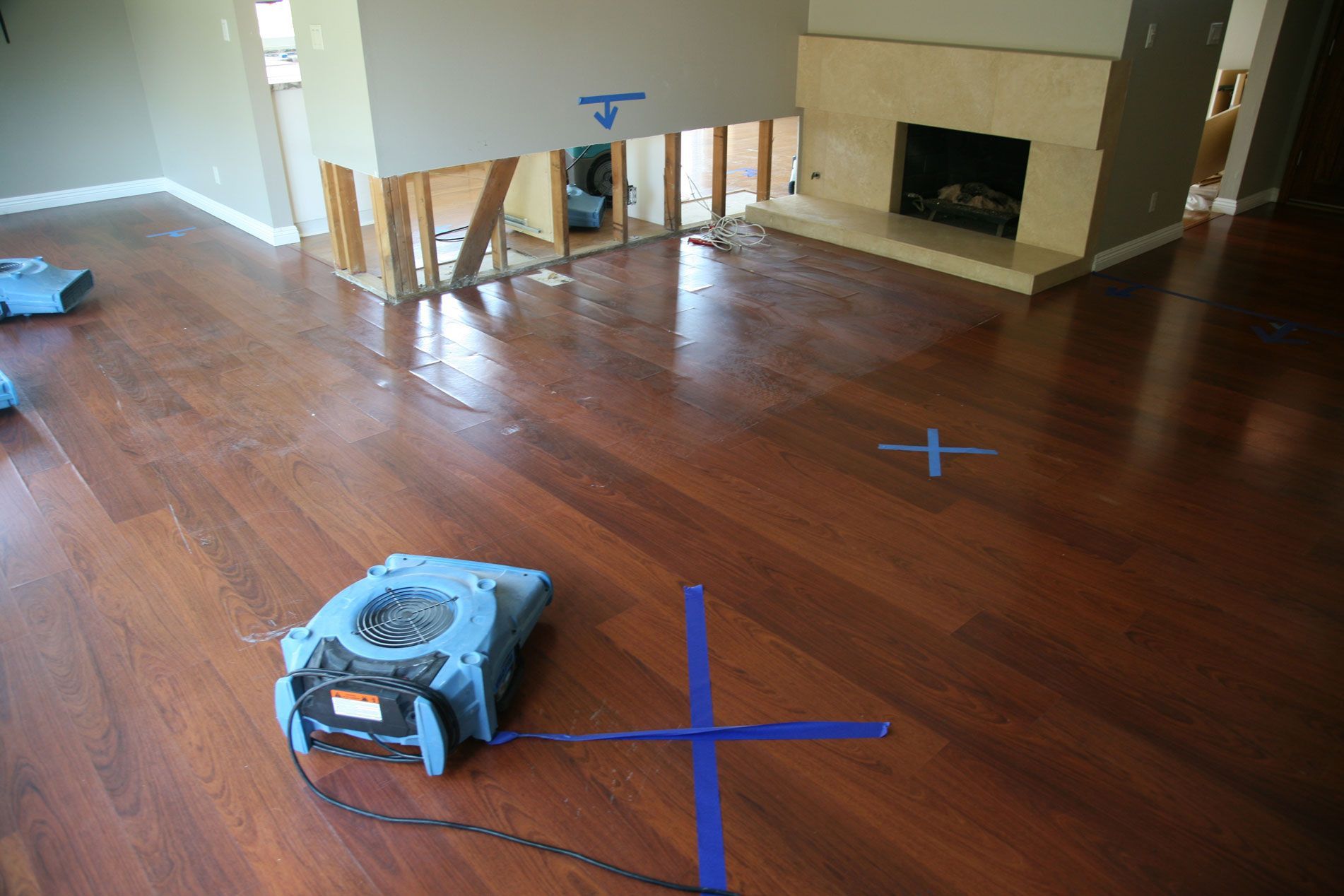 Damaged ceiling with peeling white panels and a large brown water stain and hole