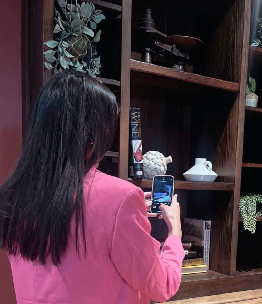 donna using iPhone to take photos