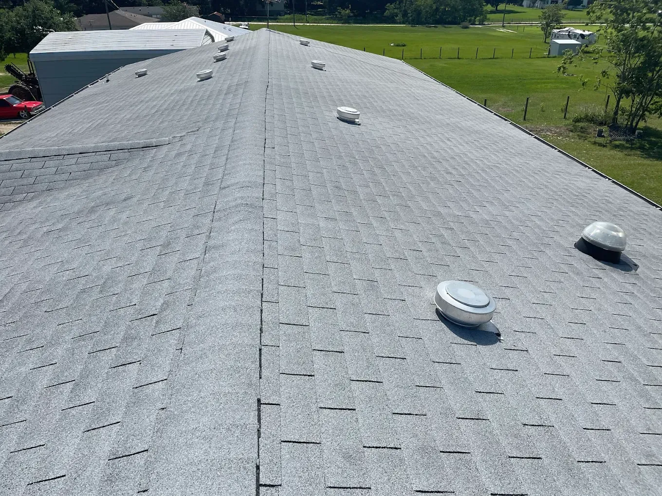 The roof of a building with a lot of vents on it.