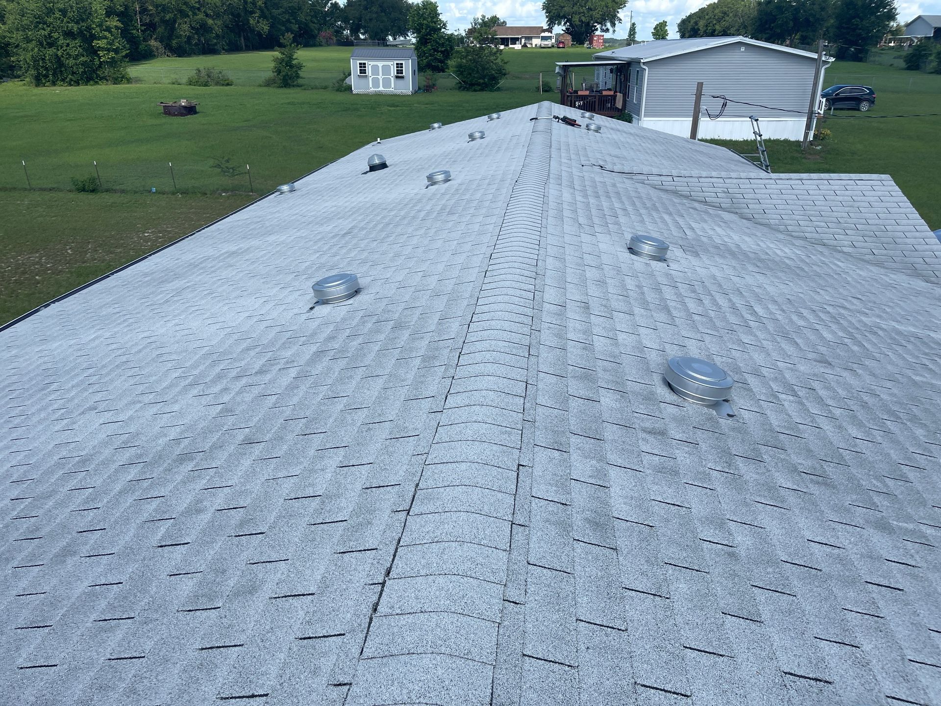 The roof of a mobile home has a lot of holes in it