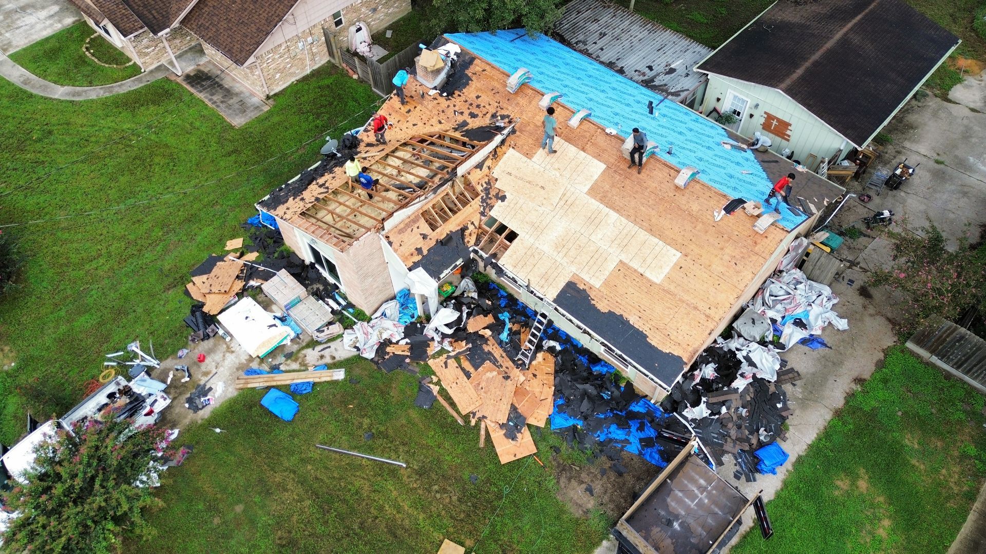 An aerial view of a house that has been damaged by a hurricane.