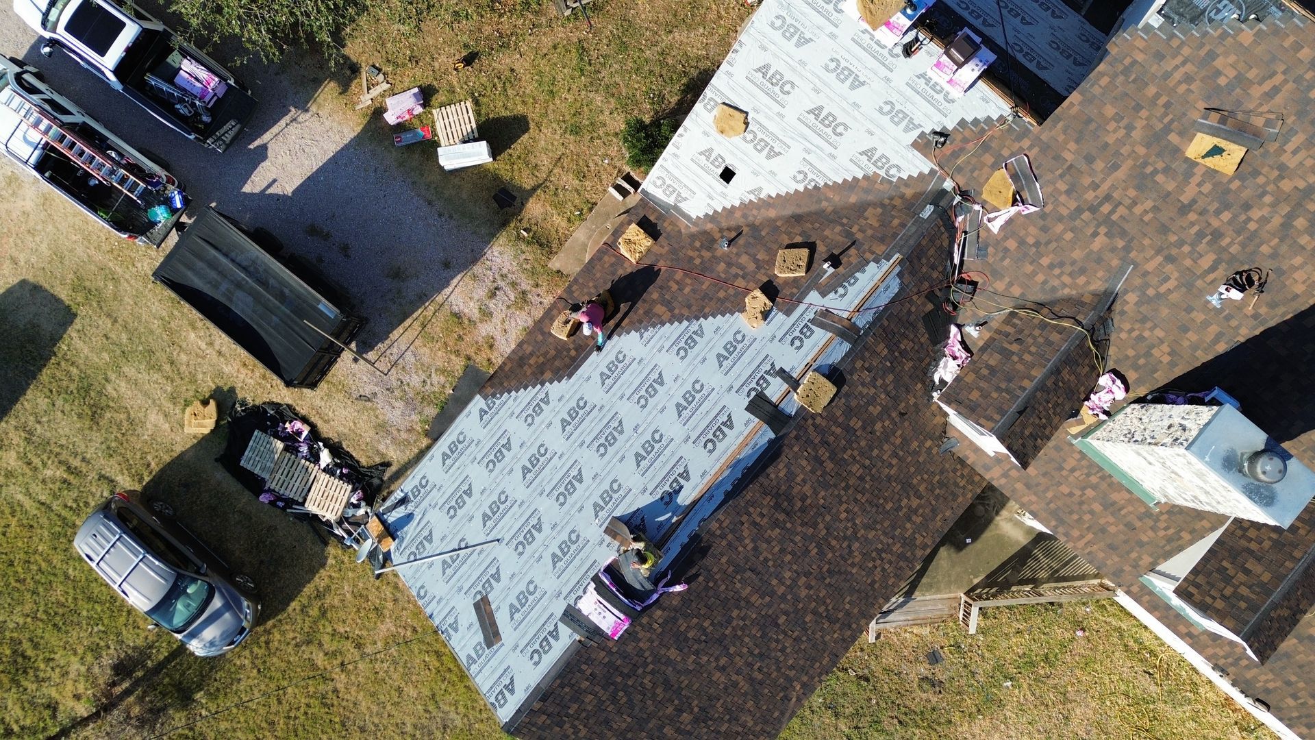 An aerial view of a roof being installed on a house.
