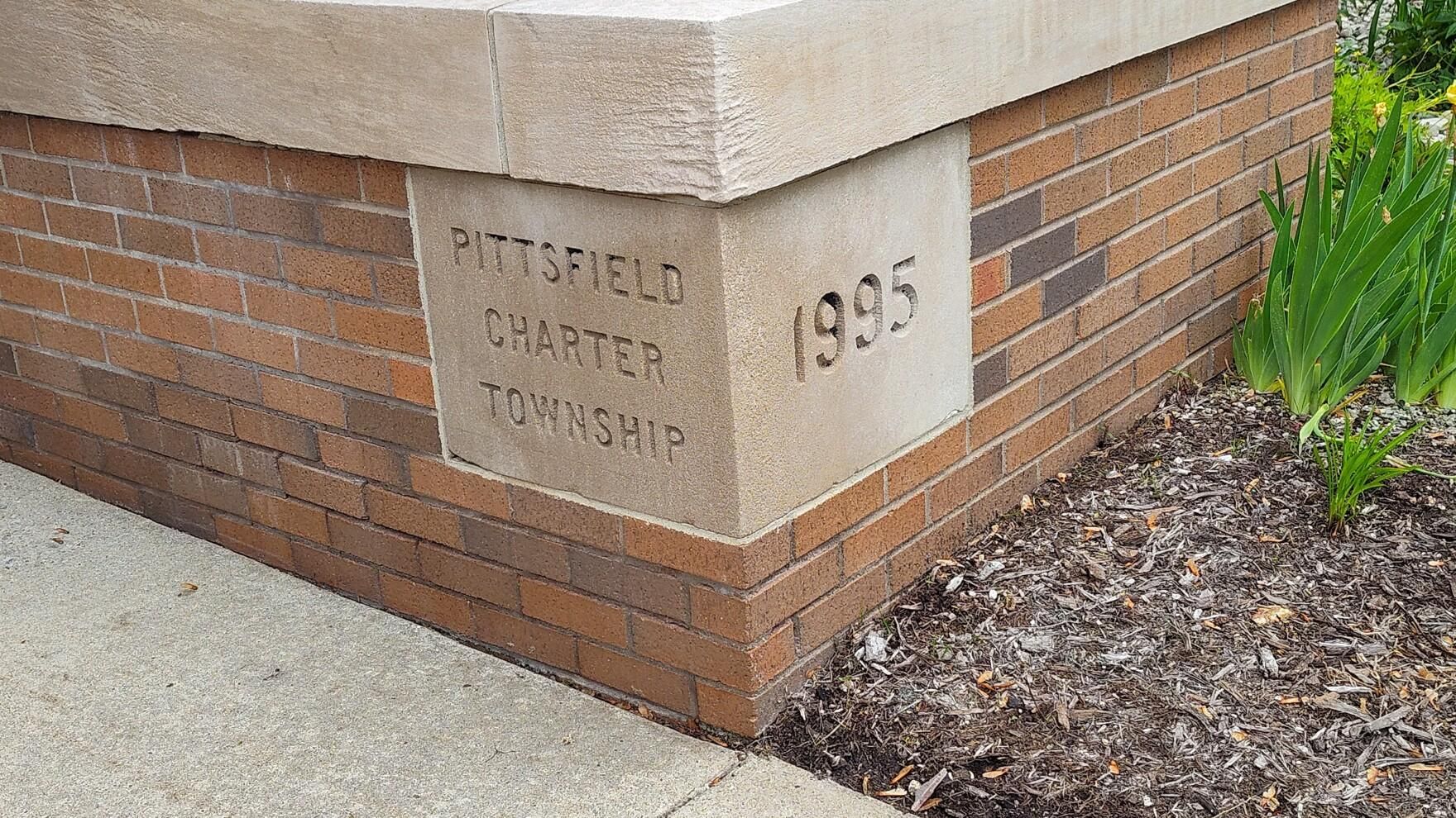 Corner of a brick building with a stone plaque reading “WATERFIELD CHAMBERS” and “1995.”