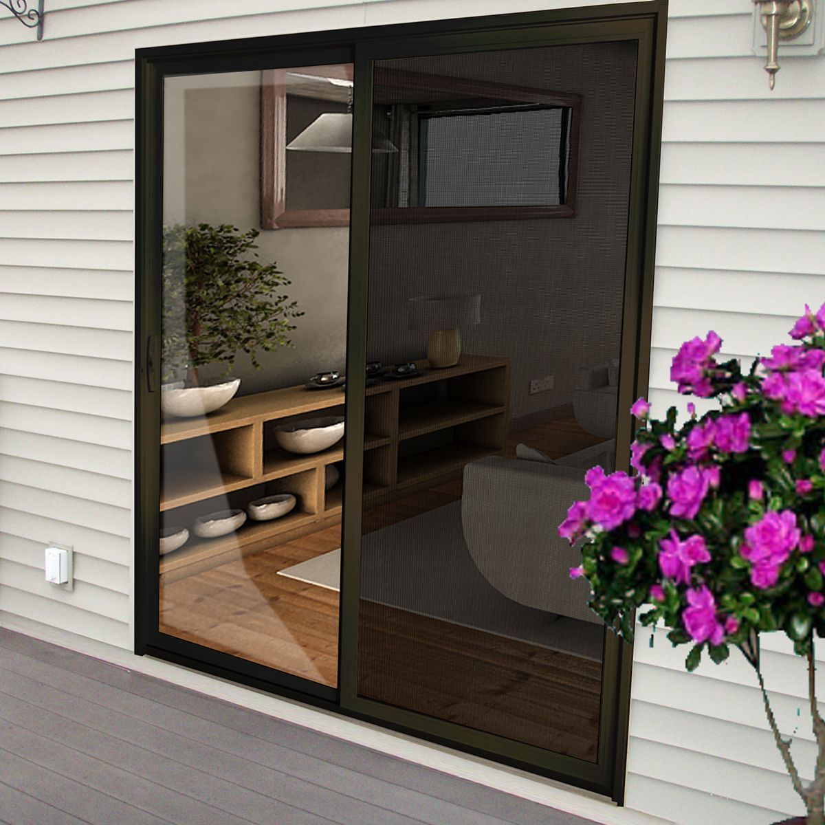 Black framed sliding screen door on a deck, showing an indoor room with shelves and a potted plant.