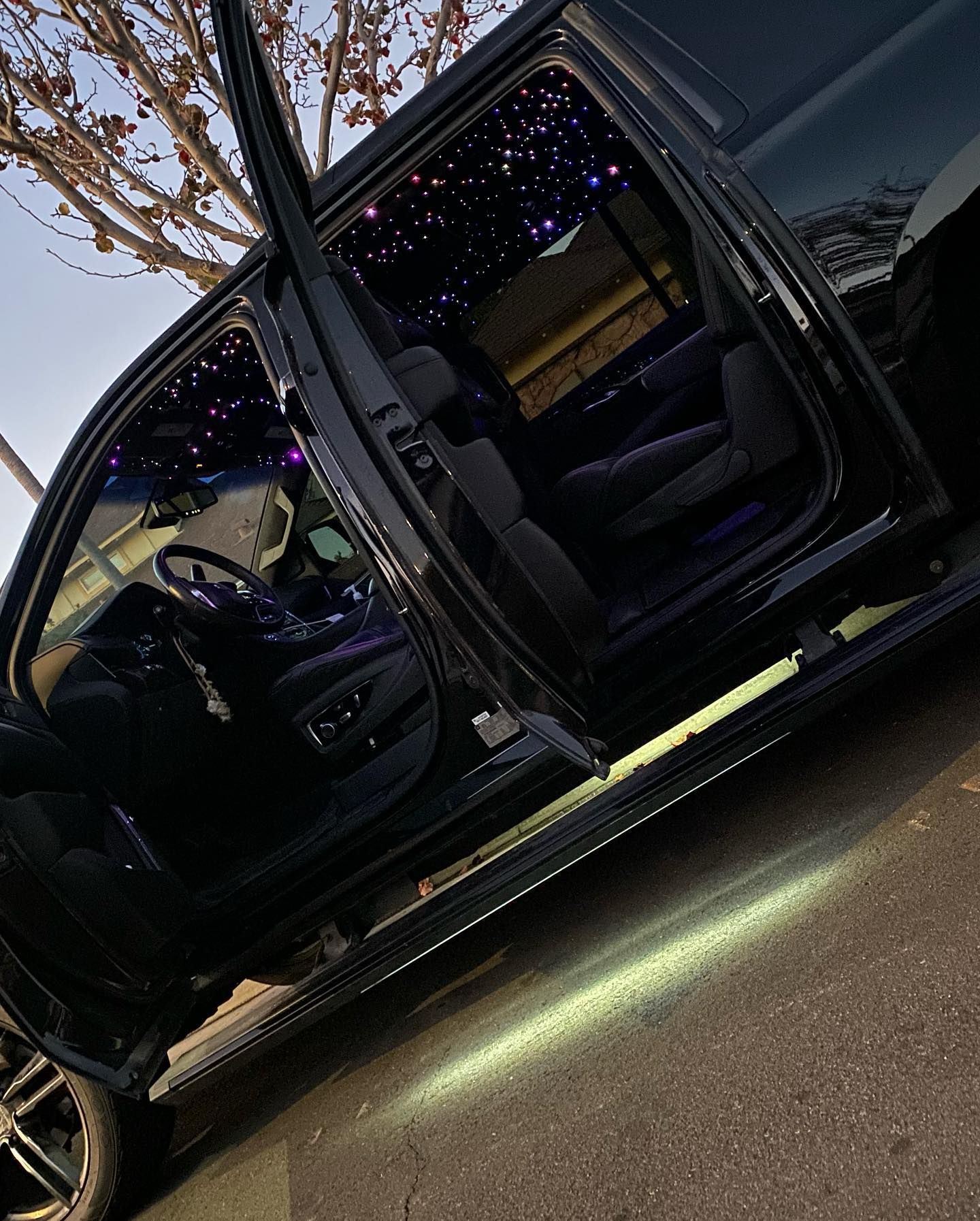 Custom star headliner installation with vehicle doors open