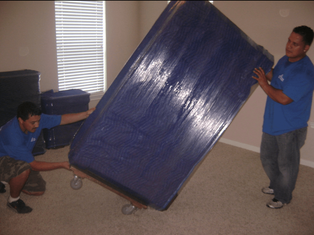 two man carrying sofa