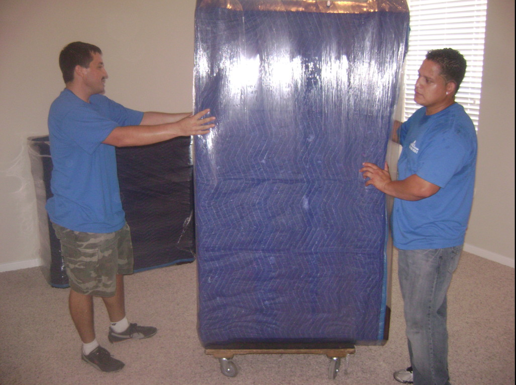 two man carrying sofa