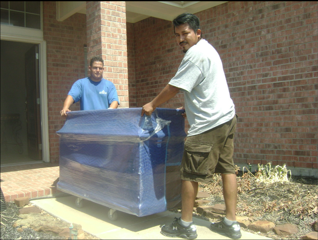 two man carrying sofa