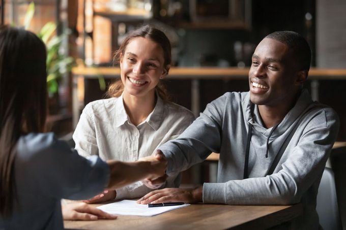 Attorney Shaking Hand with Her Happy Client