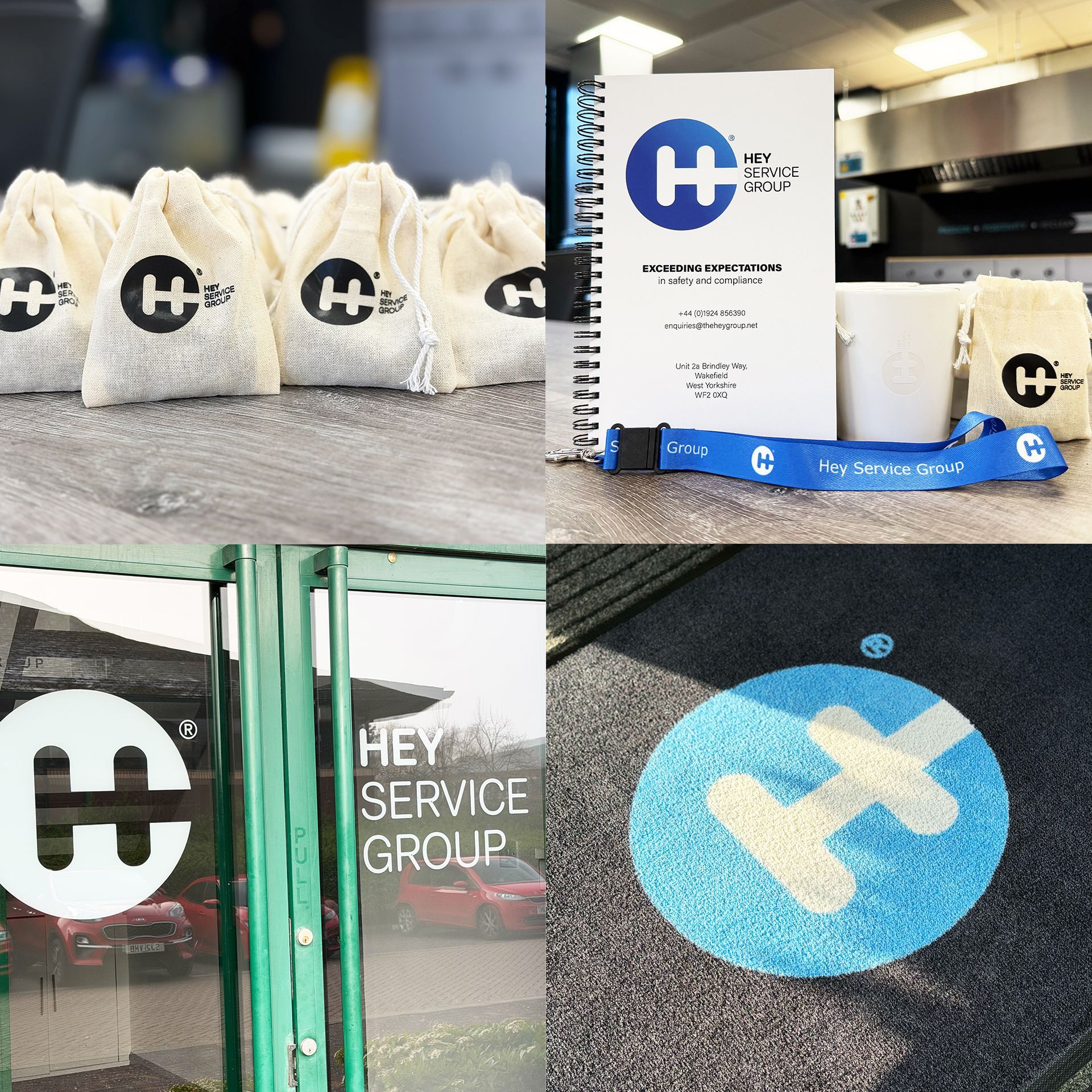 Hey Service Group branding: bags, booklet, lanyard, door, and floor graphic with the logo.