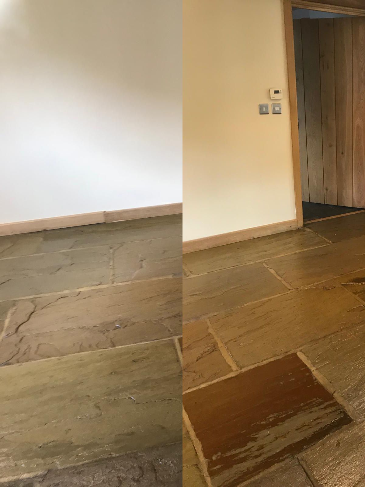 Empty room with white walls, stone tile floor, and a doorway on the right.