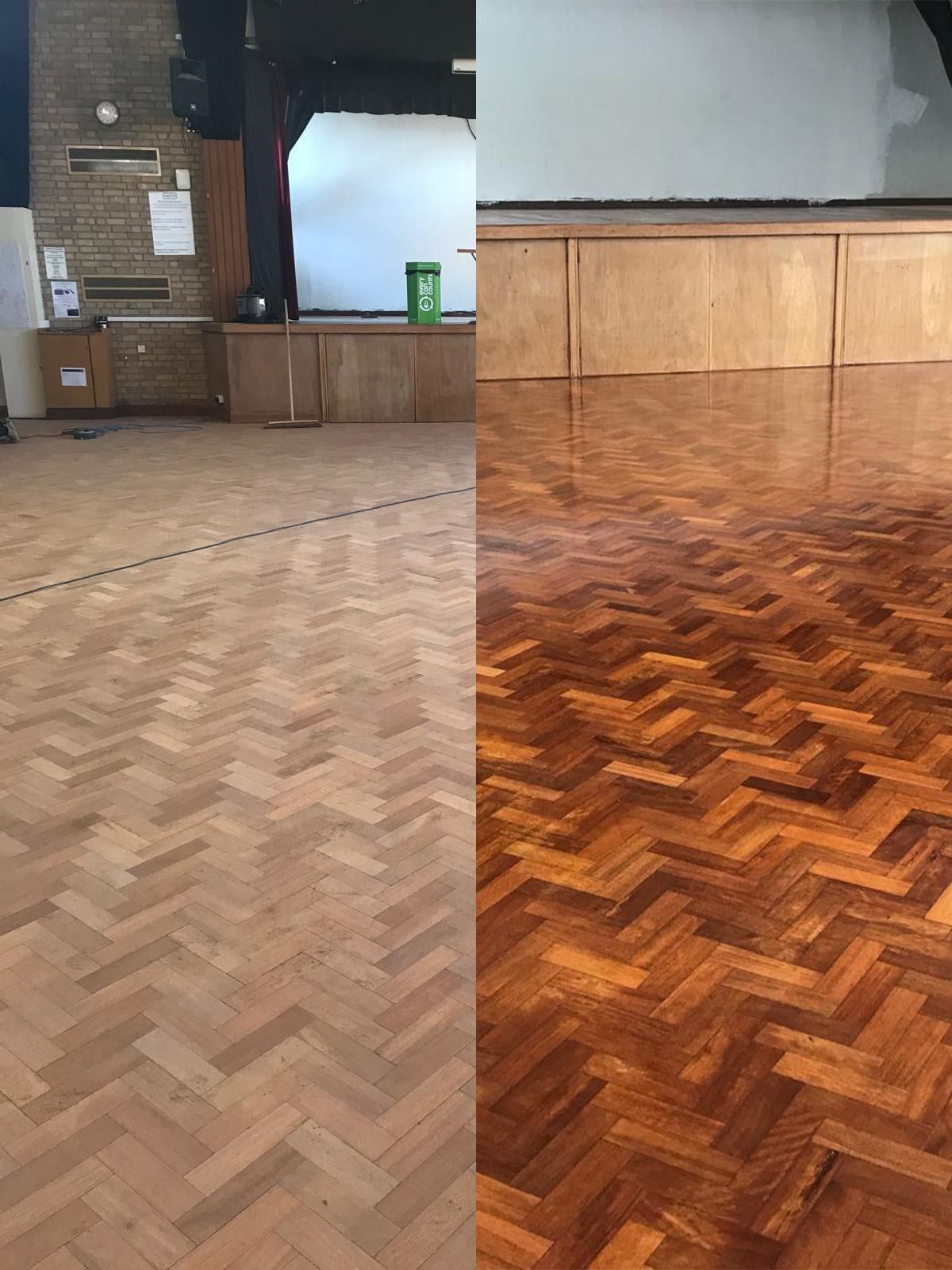 Empty hall with herringbone wood floor, stage, and a bright section of reflective flooring in the foreground