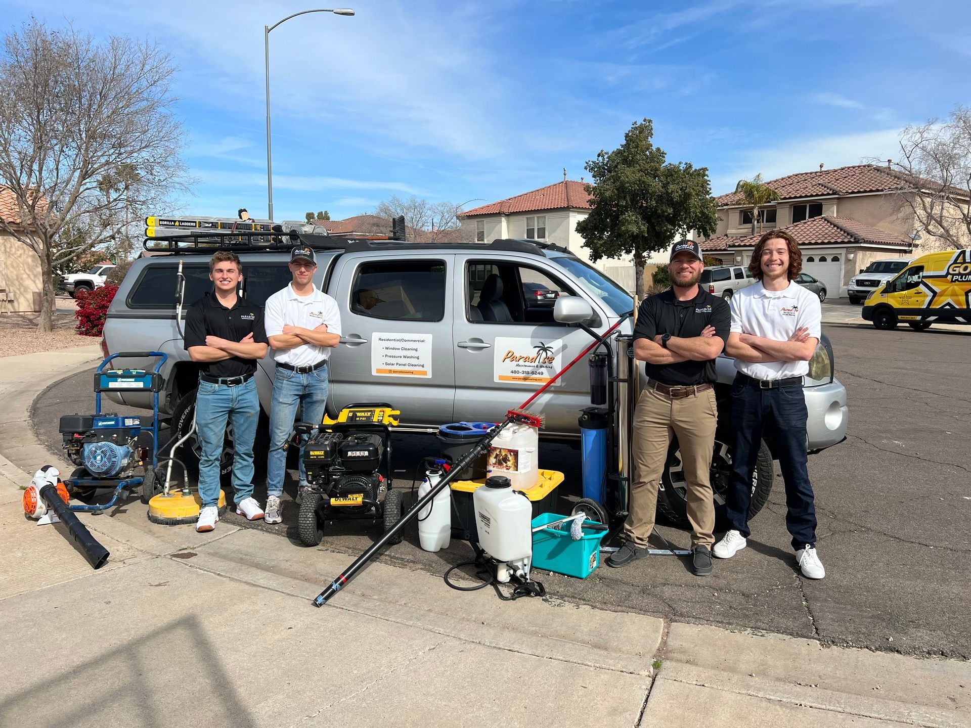 A group of men are standing in front of a van.