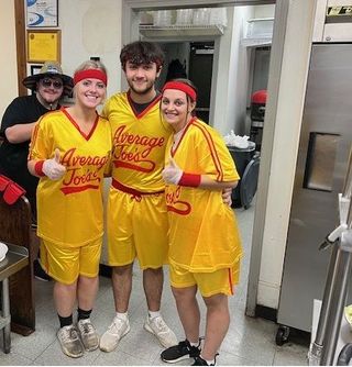 pizza palace staff dressed in Average Joe's t-shirts for Halloween